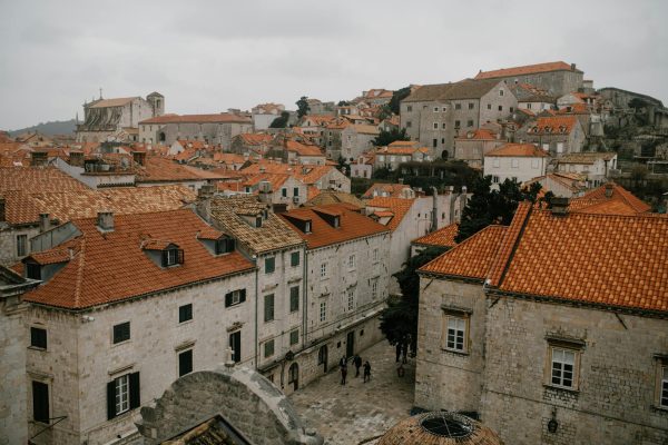 pexels-photo-5273346-5273346 From above of aged shabby houses with bright orange roofs under gloomy cloudy sky