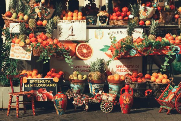 Colorful market stall in Catania, Sicily Colorful market stall in Catania, Sicily showcasing fresh fruits and local artisan crafts.