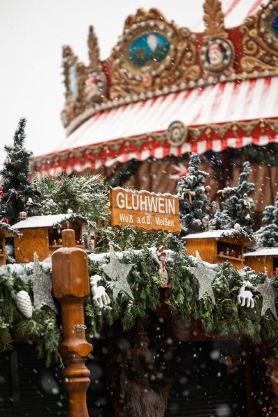 Snow falls on a festive stall selling Gluhwein at a Christmas market in Dresden, Germany. Snow falls on a festive stall selling Gluhwein at a Christmas market in Dresden, Germany.