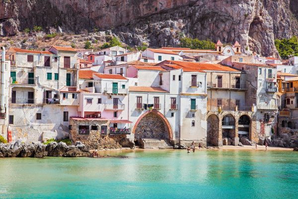 Sicily Travel - Old building on beach in Cefalu , Sicily